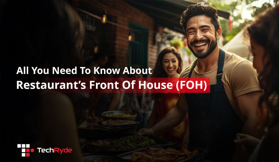 Server in apron interacting with diners at a restaurant, representing Front of House (FOH) operations.